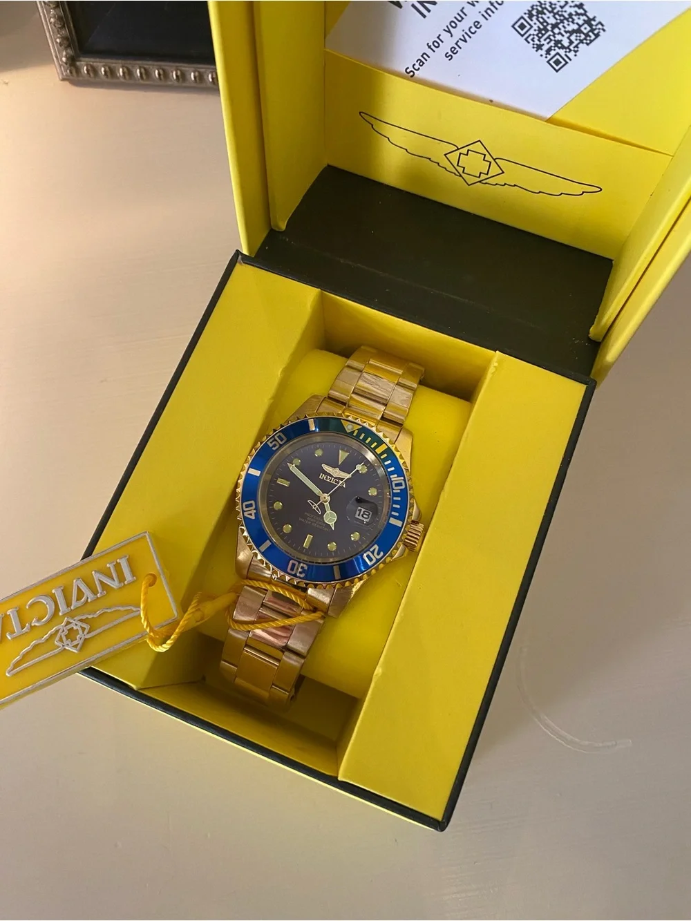 Invicta Gold Tone Watch with Blue Bezel and Dial